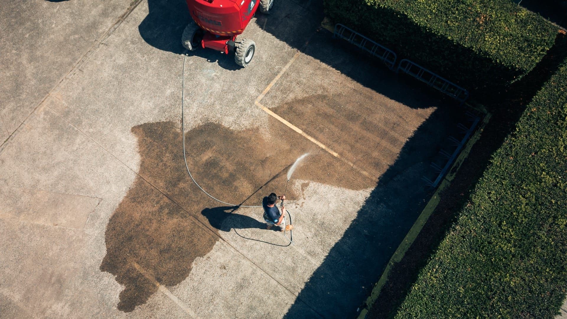 Restored concrete driveway after pressure cleaning in Brisbane