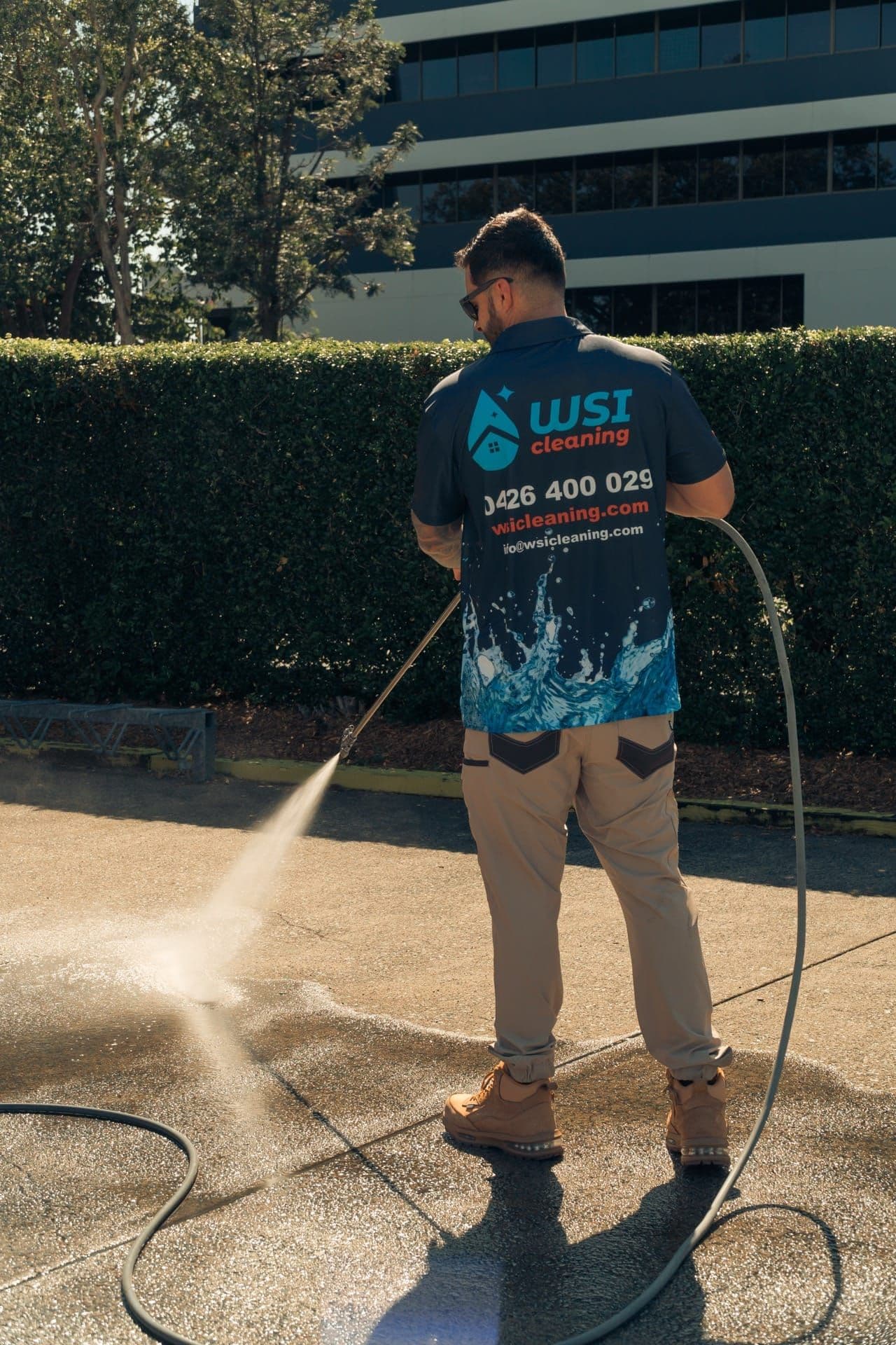 Commercial-grade pressure washer restoring a Brisbane concrete surface