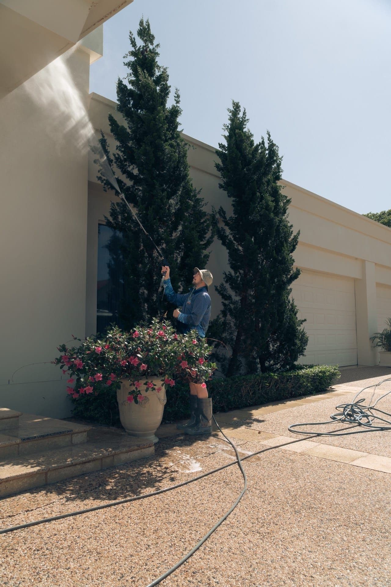 Soft-wash exterior house cleaning on a rendered Brisbane home